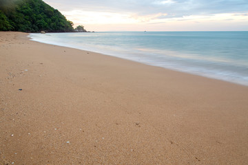 Bubbles of sea waves on the beach with sand.Sea breeze blowing waves to the beach.There are feeling fresh and succulent for this image.Can use for add text and abstract background.