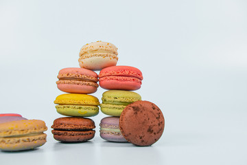 Assorted colorful macaroons on light background, copy space