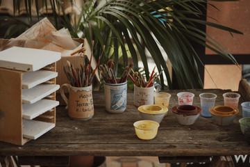 Craftsman decorates handmade terracotta