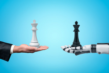 Side view of human hand holding white chess king and android robot hand holding black chess king opposite one another on light blue background.