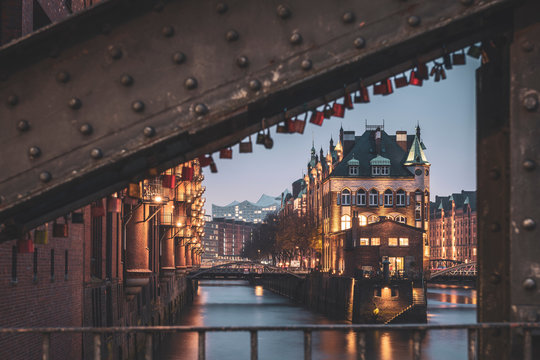 Germany, Hamburg, Illuminated Wasserschloss castle in Speicherstadt district at dusk