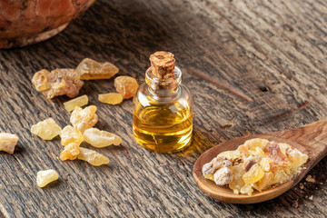 A bottle of frankincense essential oil and frankincense resin
