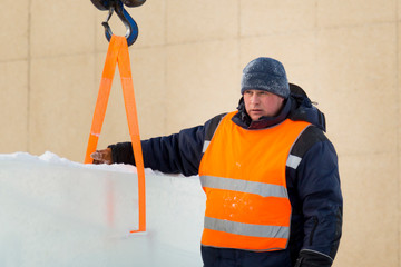 Portrait of installer at unloading ice blocks