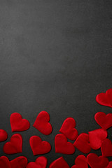 Valentine's day, a Declaration of love. Lots of red hearts on a dark graphite background.