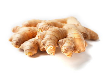 Fresh ginger root on a white background, isolate close-up.