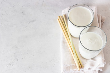 Homemade kefir. Organic probiotic kefir drink or yogurt with probiotics in glasses. Probiotic cold fermented dairy drink. Trendy food and drink. 