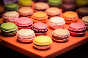 Obraz na płótnie Canvas mix french macaroons close up view with different flavours & colours
