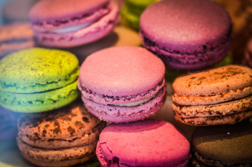 Fototapeta na wymiar mix french macaroons close up view with different flavours & colours