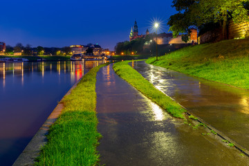Krakow. The facade of the famous Wawel Castle in night lighting.