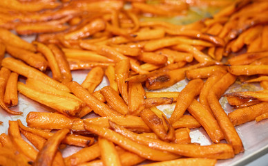Dried carrots on a metal tray. Beautifully toasted in the oven.