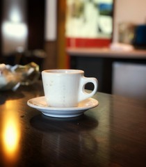 cup of coffee on wooden table