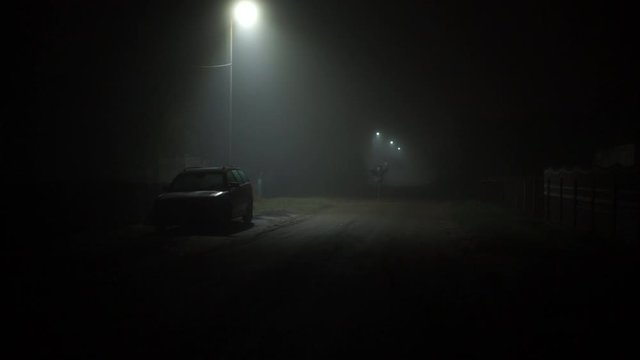 A man escapes from a criminal. Horrors. A man runs down a dark street. Kriminal.Mysticism. Night snapshot.