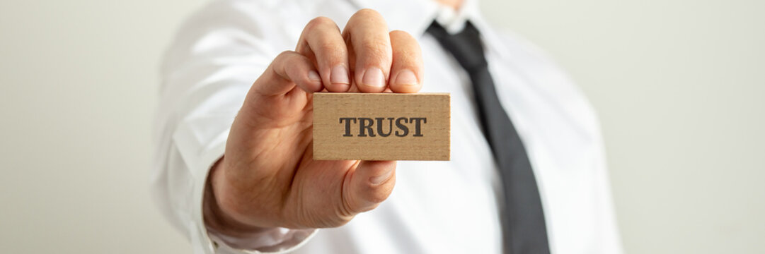 Businessman holding Trust card