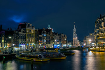 Fototapeta na wymiar City scenic from Amsterdam by night with the Munt tower in the Netherlands