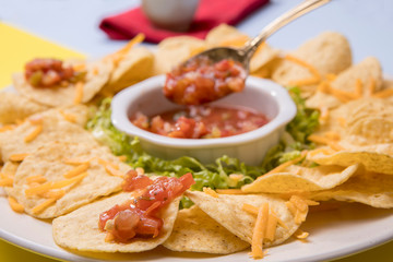 Close up of salsa on chips.