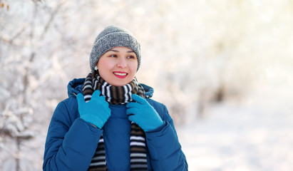 portrait of a young happy girl woman in winter clothes