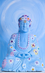 happy buddah in blue with colorful decoration