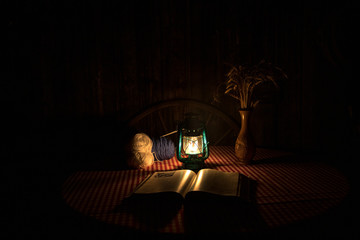 Fototapeta na wymiar A horizontal photo of a oil lamp in the dark.