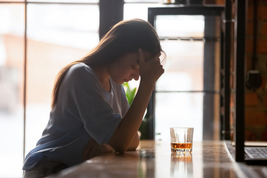 Desperate Woman Drinking Alone Suffering From Addiction
