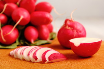 Radish on wooden cutting board