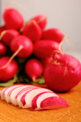 Radish on wooden cutting board