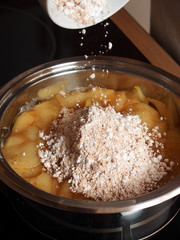 Add Cinnamon and Powdered Sugar into boiled apples. Making Apple Pie Tart Series.