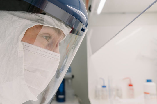 Close-up of researcher wearing safety helmet in laboratory