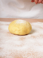 Fototapeta na wymiar Sprinkle dough with flour. Making Apple Pie Tart Series.