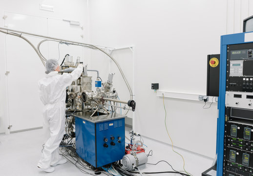 Laboratory technician working on a device in laboratory of science center