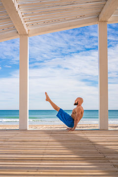 Sportsman training at the beach
