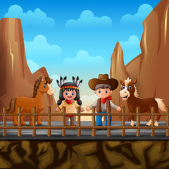 Fototapeta premium Cowboy with indian girl and horse at the desert