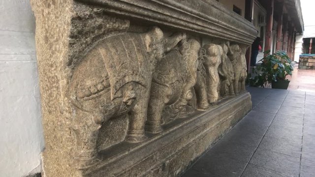 Kandy, Sri Lanka, November 25, 2019, Sri Dalada Maligawa stone figures on the wall in the temple 4K