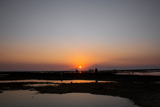 Sunset in Gili Trawangan Lombok. Orange is my favorite color. Loking at Mt Agung. Gili Travangan island enjoying evening sunset view on Gunung Agung volcano on Bali, Indonesia.
