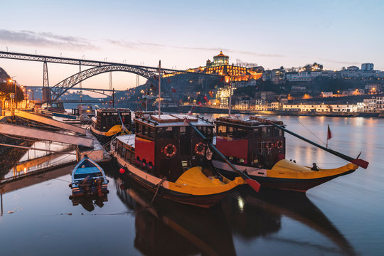 Portugal, Porto District, Porto, Rabelo boats moored on Douro river at dawn