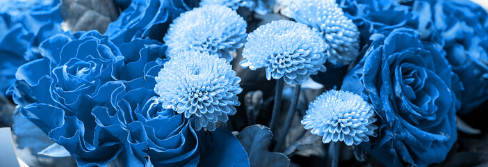 Bouquet of roses and chrysanthemums close up. Beautiful flower background. Blue floral backdrop....