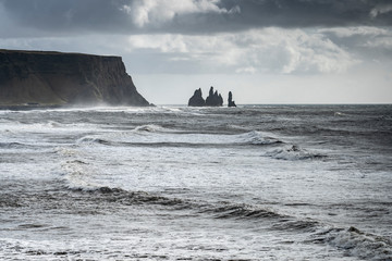 volcanic rock formation of Dyrholaey near Vik in stormy weather southern Iceland