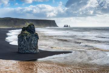 volcanic rock formation of Dyrholaey near Vik in stormy weather southern Iceland