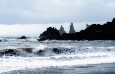 volcanic rock formation of Dyrholaey near Vik in stormy weather southern Iceland