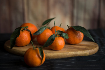 Group of tangerines on a wood.