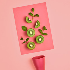Kiwi Fresh Fruit with Mint leaves. Vegan healthy Organic food Concept. creative green layout. Flat lay. Trendy fashion Style. Minimal Art. Hot Summer Vibes. Bright Pink Color.