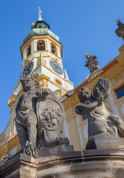 PRAGUE, CZECH REPUBLIC - OCTOBER 14, 2018: The baroque angel before facade of Loreto church  - designed by Kilian Ignac (1772).