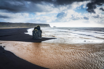 volcanic rock formation of Dyrholaey near Vik in stormy weather southern Iceland