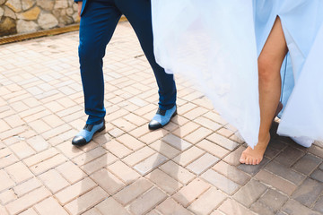 man in blue shoes and barefooted woman