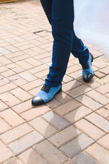 man walking in blue shoes