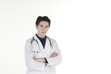 Fototapeta premium the young asian medical doctor and his stethoscope at isolated white background copy space 