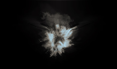 Flying bird. Dispersion, splatter effect. Black background. 