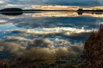 Clouds Mirrors sunset at lake steinberg in the Bavarian forest 