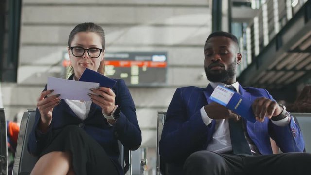Passengers in airport business lounge waiting for delayed flight