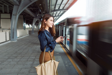 Beautiful business woman in metro train in city