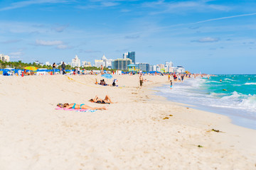 Beachgoers Enjoying The Beautiful Beaches of South Beach, Miami.